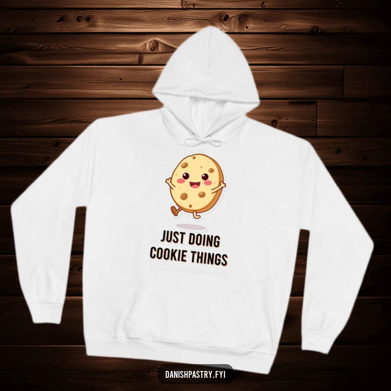 Funny Cookie Hoodie with a beaming character doing a tiny cartwheel, offering sweet comfort and a dose of playful humor.