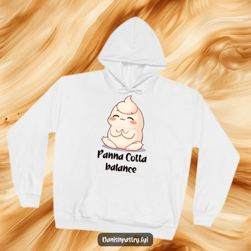Funny and cozy hoodie featuring a wobbly panna cotta in a concentration-filled yoga pose, offering comfort and humor.