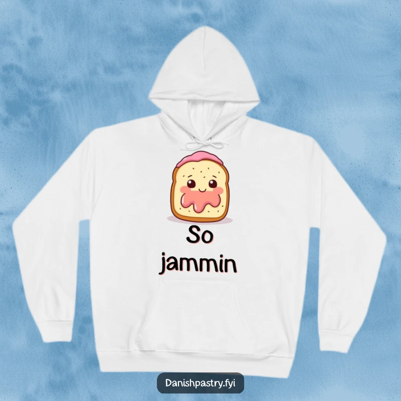 Funny Hoodie depicting a smiling scone with jam, blushing and waving shyly, offering warmth and humor.