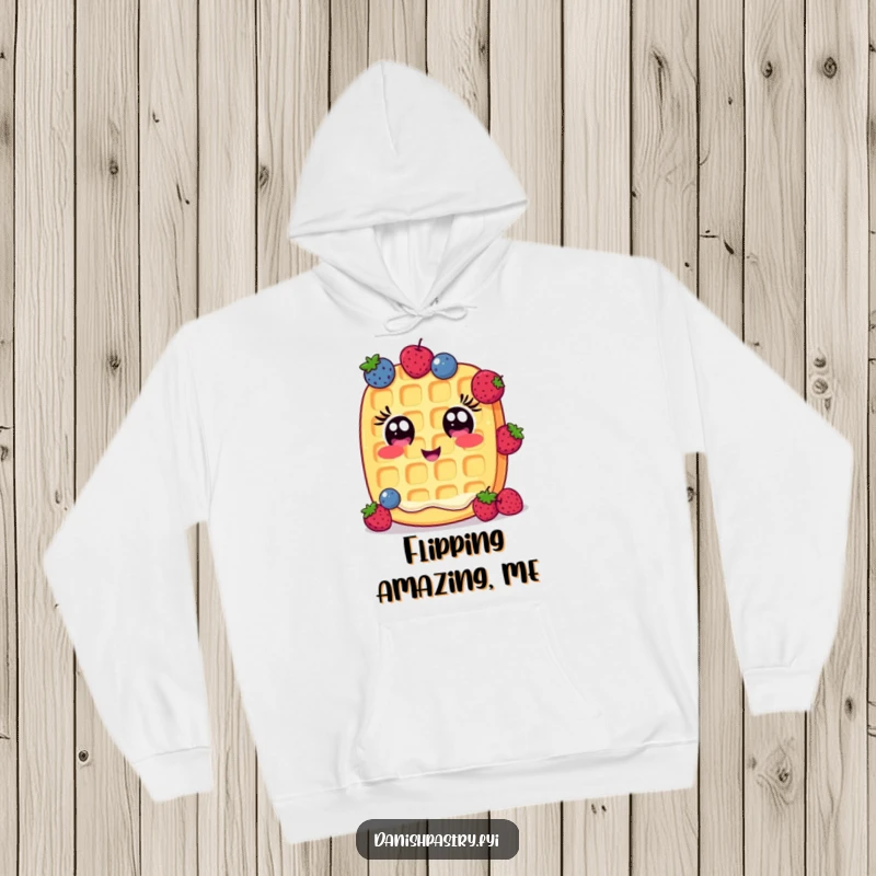 Funny Hoodie: A cheerful waffle with wide eyes comically juggles small berries, a warm and humorous apparel choice.