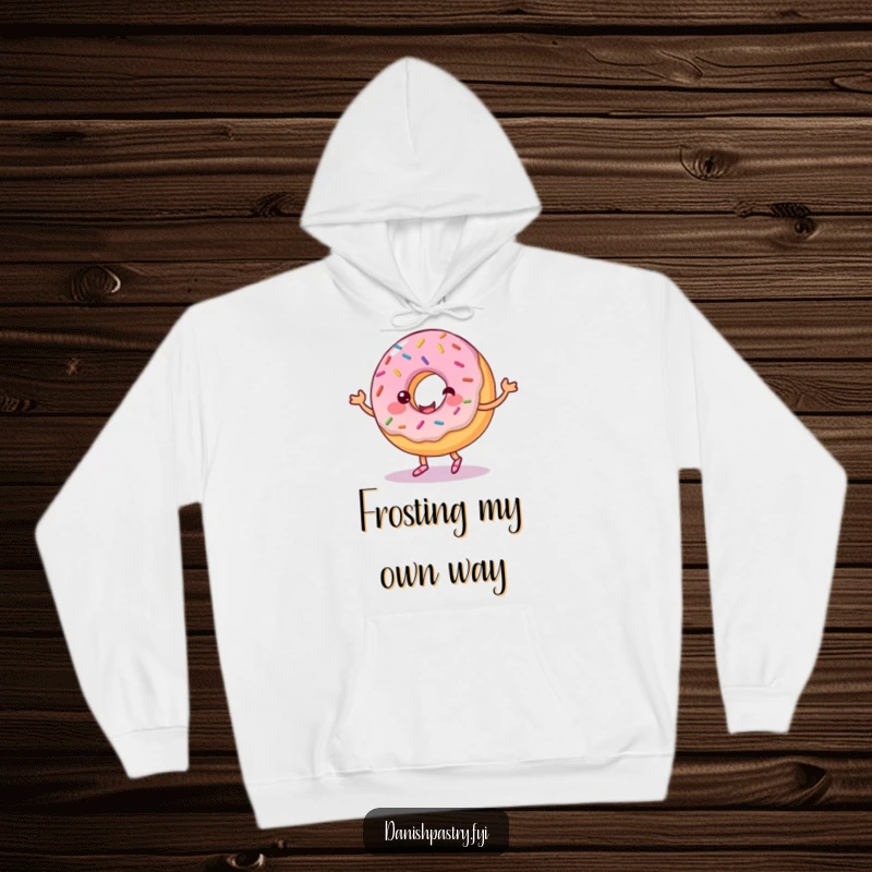 Funny hoodie depicting a cheerful donut with sprinkles, engaged in a playful dance with a frosting ribbon. Cozy and humorous apparel.