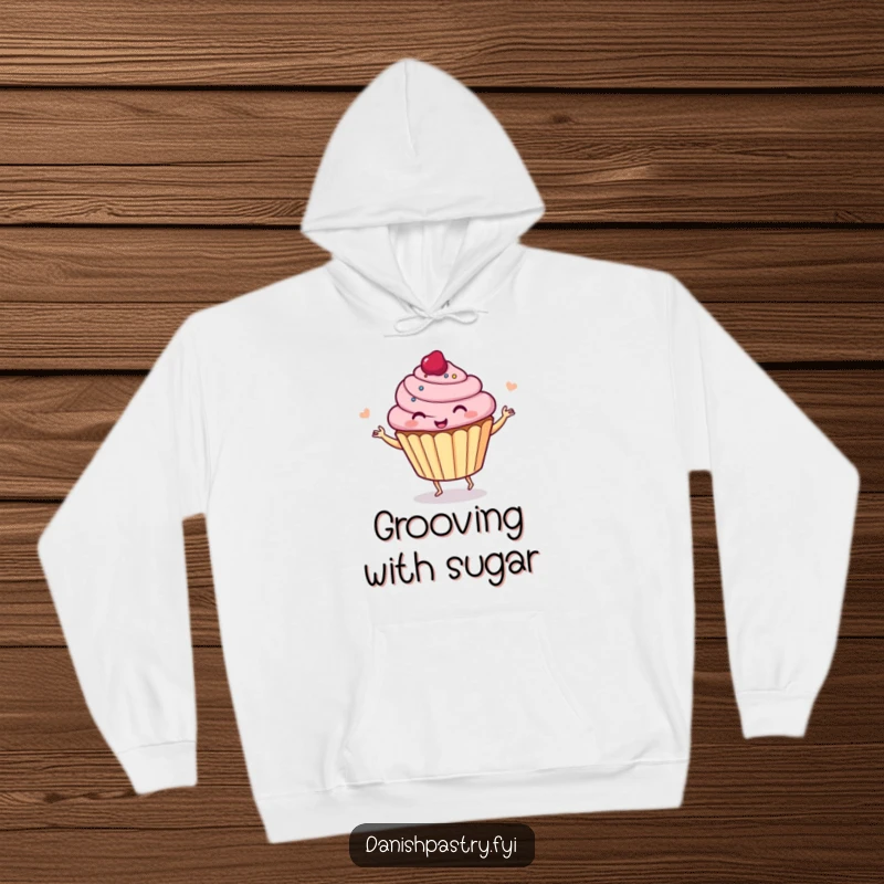 Funny cupcake dancing happily, depicted on a warm hoodie, perfect for staying cozy and spreading cheer.