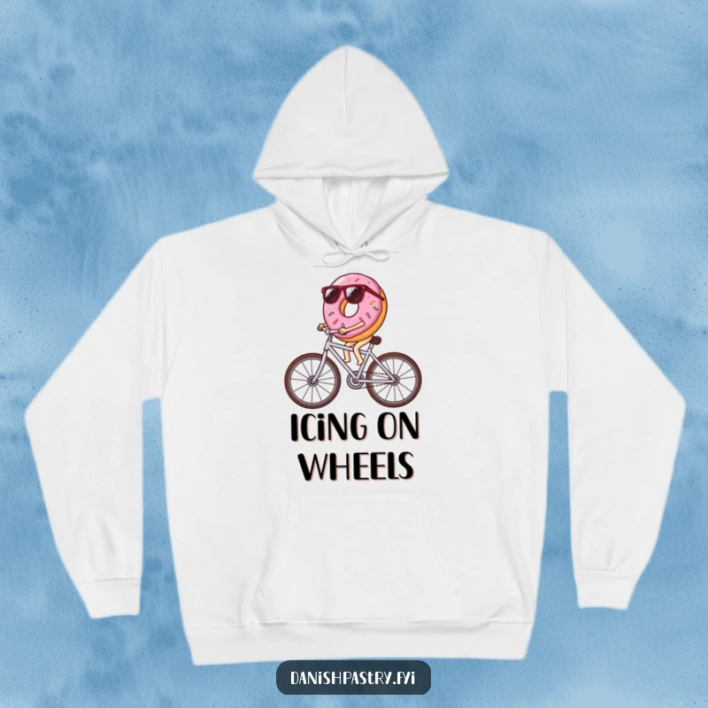 Funny donut wearing sunglasses riding a bicycle made of icing streaks, a warm and humorous hoodie for cool riders and pastry fans.