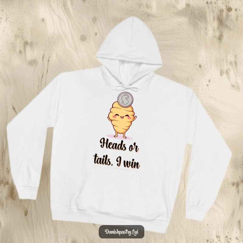 Funny hoodie featuring a mischievous croissant character flipping a coin, offering warmth and playful charm.