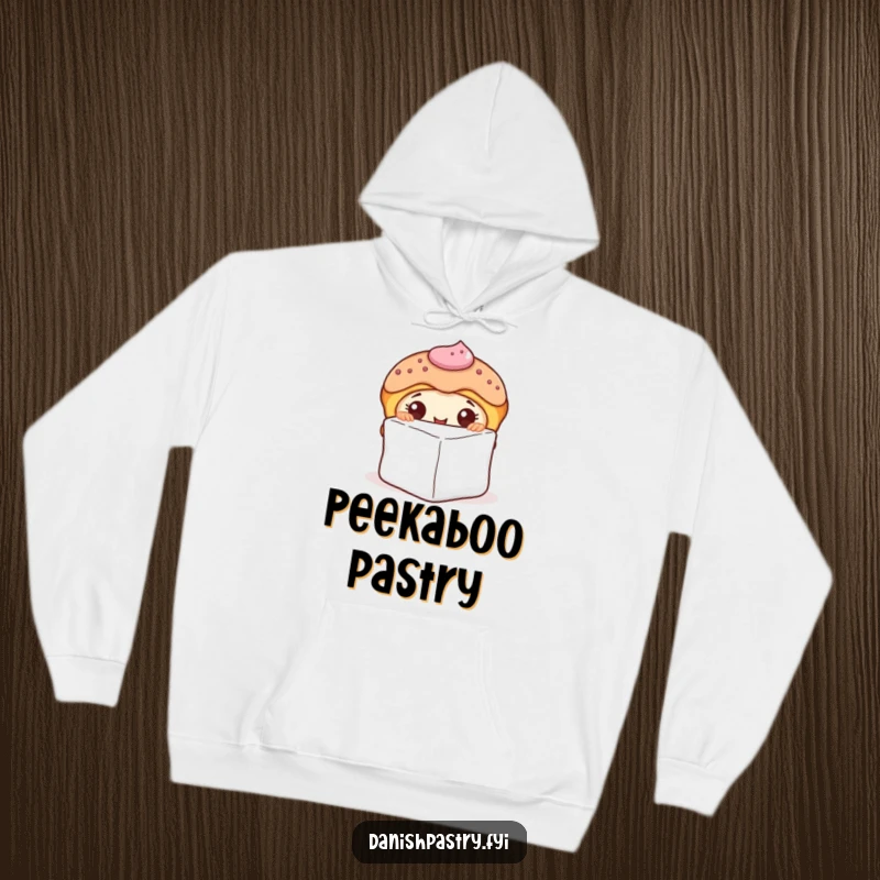 Funny hoodie depicting a curious Danish pastry character with icing, peeking from behind a sugar cube, offering a sense of sweet suspense.