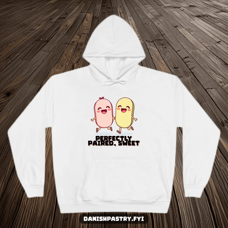 Funny and cozy hoodie featuring a happy pair of macarons holding hands and skipping, symbolizing joy and companionship.