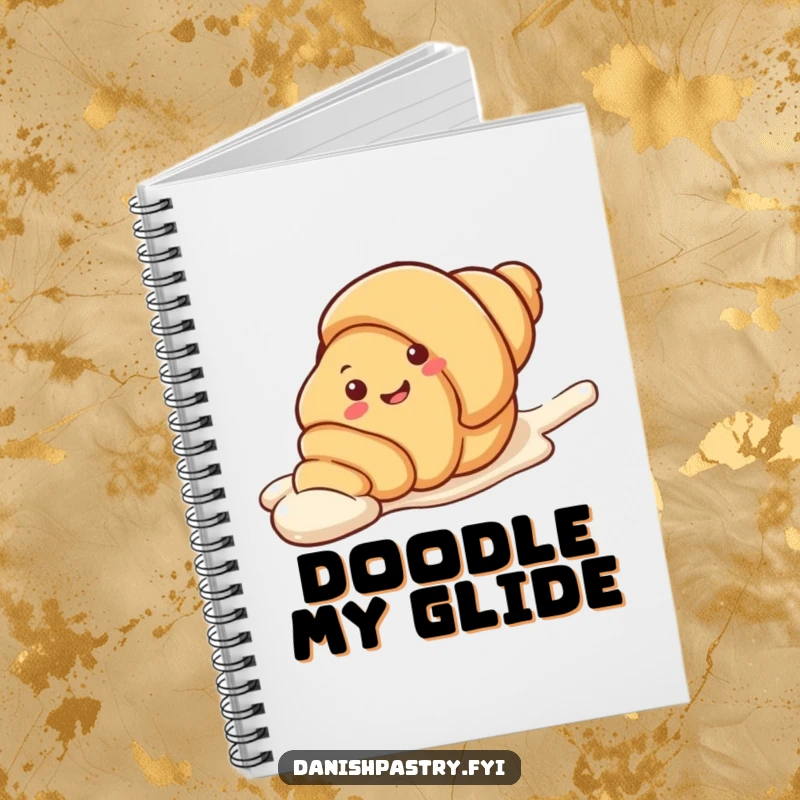 Funny Notebook featuring a smiling croissant character sliding on a streak of icing. Ideal for sweet thoughts and creative notes.