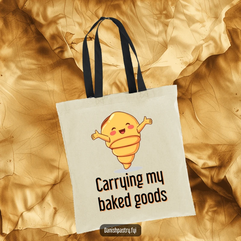 Funny Tote Bag showcasing a smiling croissant doing a joyful cartwheel, great for carrying essentials with flair.